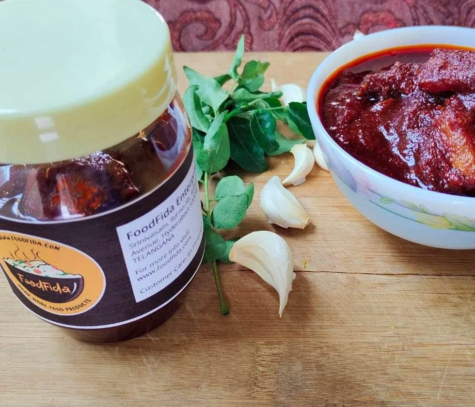 Authentic homemade Andhra Bellam Avakaya pickle with raw mangoes, jaggery, and spices – a sweet, tangy, and spicy delight from FoodFida.