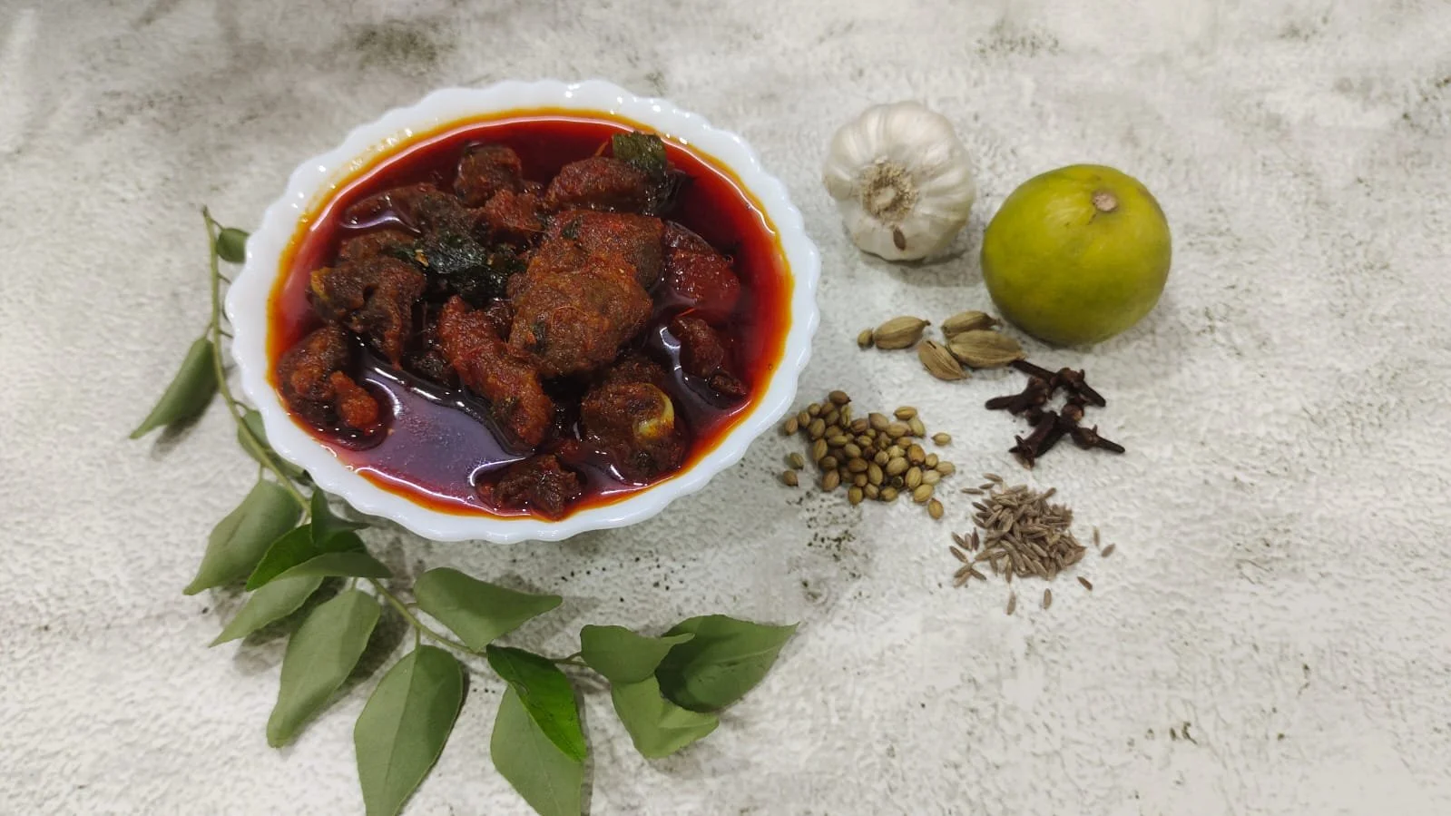 A jar of homemade mutton boneless pickle, made with tender mutton, aromatic spices, and mustard oil for a rich, spicy, and authentic flavor.